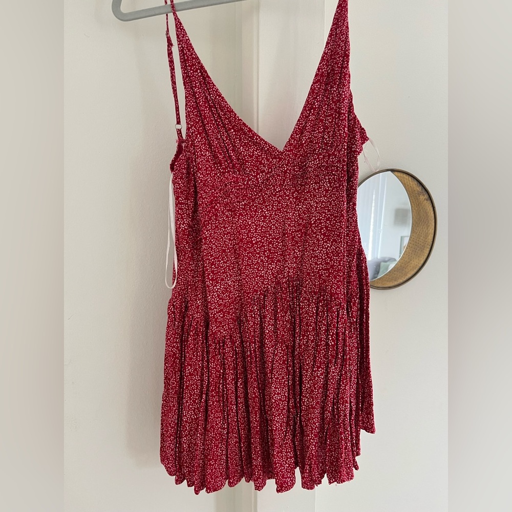 Princess Polly red romper with small white flowers